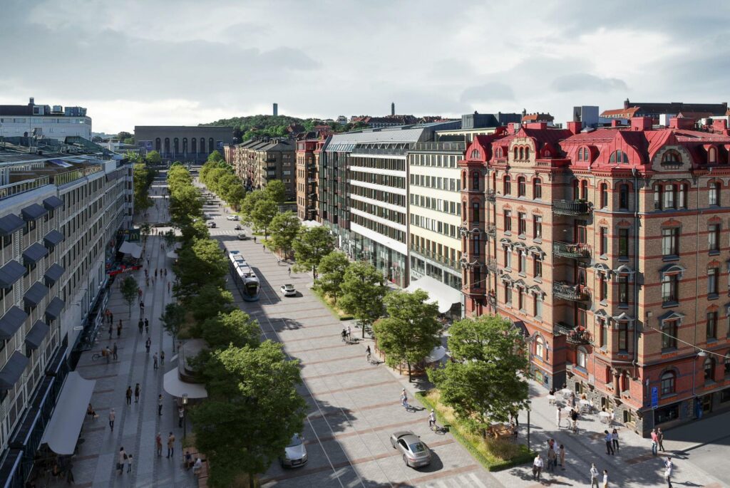 Breda trottoarer avgränsas av en grönskande allé, som ramar in ett körfält för spårvagnar och bilar i mitten.